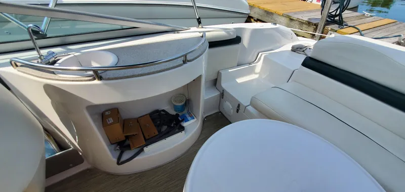 Slide: The Image of Interior of 2002 Four Winns 240 Horizon boat with seating and storage. - 13
