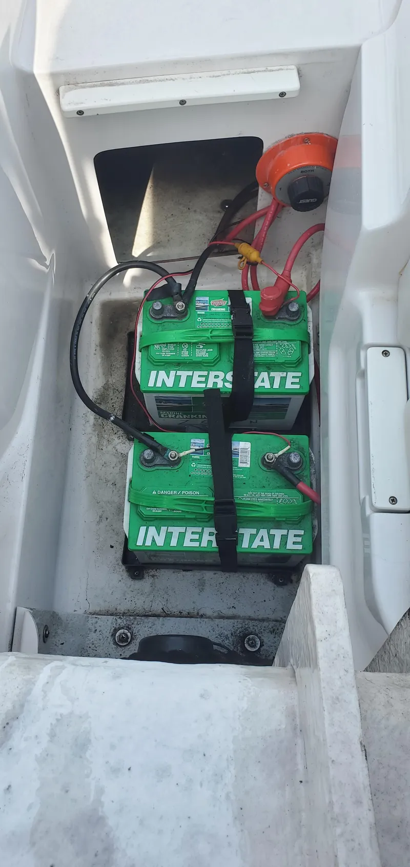 Slide: The Image of 2002 Four Winns 240 Horizon boat battery compartment with Interstate batteries. - 4