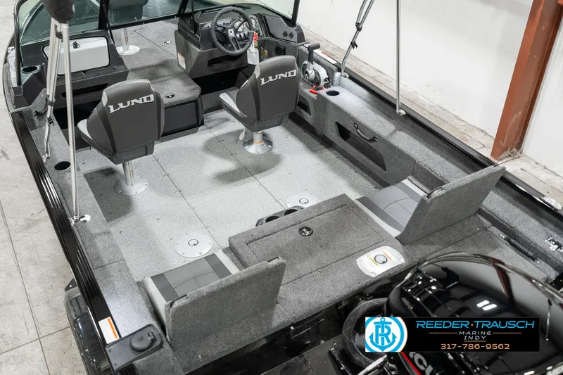 Slide: The Image of 2025 Lund 1775 Adventure Sport boat interior with seating and steering console. - 11