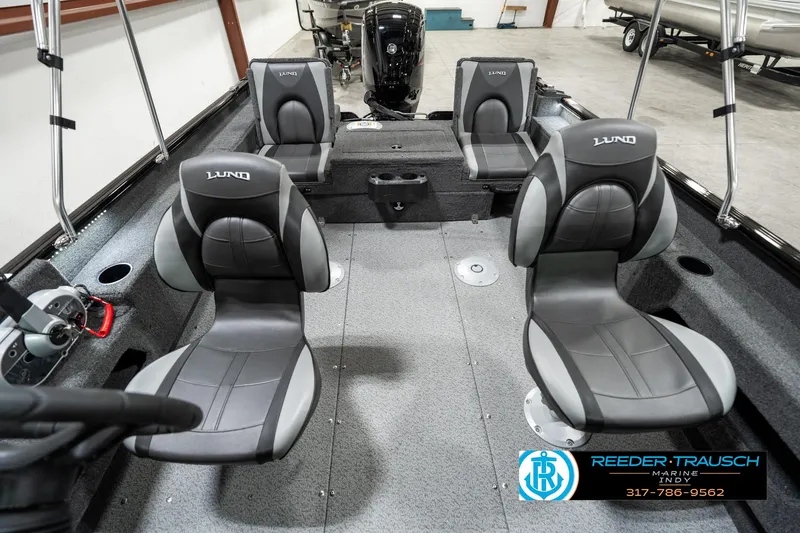 Slide: The Image of 2025 Lund 1775 Adventure Sport boat interior with four seats and steering console. - 13