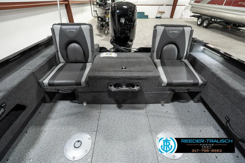 Slide: The Image of 2025 Lund 1775 Adventure Sport boat interior with dual seats and motor. - 14