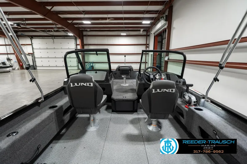 Slide: The Image of 2025 Lund 1775 Adventure Sport boat interior in a spacious garage setting. - 16