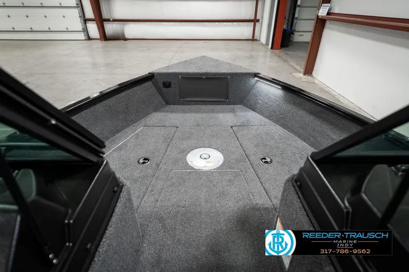 Slide: The Image of 2025 Lund 1775 Adventure Sport boat interior in a showroom. - 18