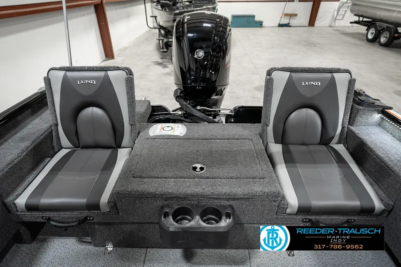 Slide: The Image of 2025 Lund 1775 Adventure Sport boat interior with dual seats and motor. - 24