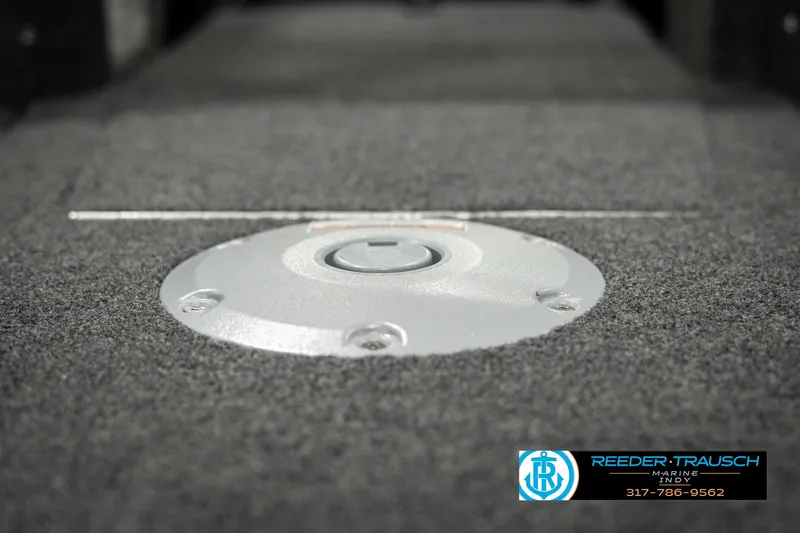 Slide: The Image of 2025 Lund 1775 Adventure Sport boat interior with carpeted flooring and storage compartment. - 36