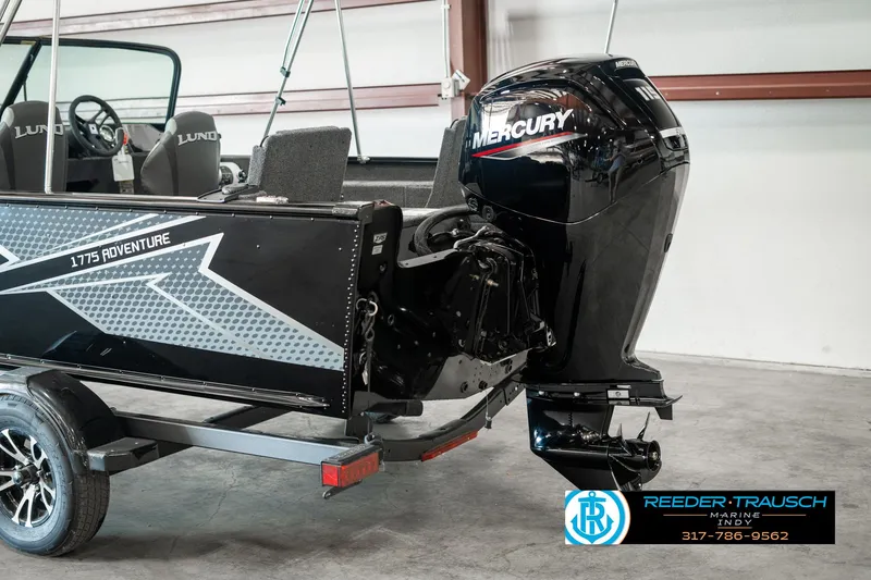 Slide: The Image of 2025 Lund 1775 Adventure Sport boat with Mercury outboard motor in showroom. - 39