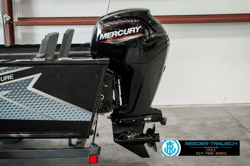 Slide: The Image of 2025 Lund 1775 Adventure Sport boat with Mercury outboard motor in a showroom. - 40