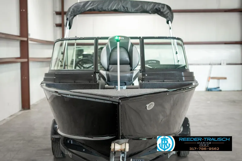 Slide: The Image of 2025 Lund 1775 Adventure Sport boat in a showroom, front view. - 7