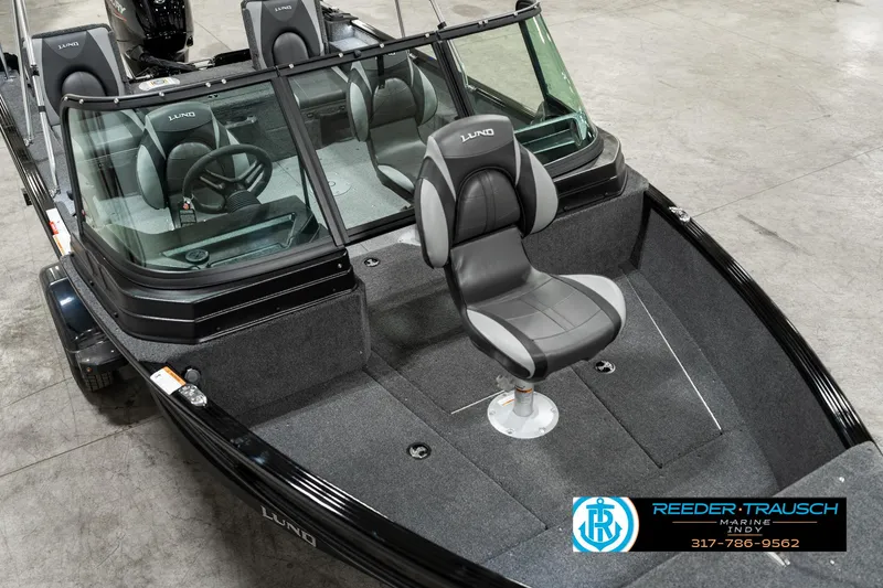 Slide: The Image of 2025 Lund 1775 Adventure Sport boat with seating, showcased indoors. - 9