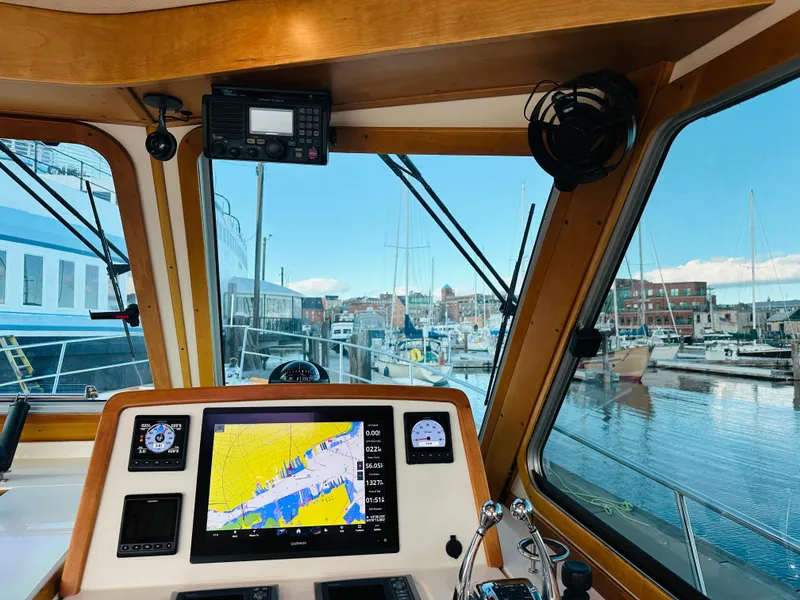 Slide: The Image of 2009 Sabre 42 Hardtop Express helm with navigation display, docked at marina. - 19