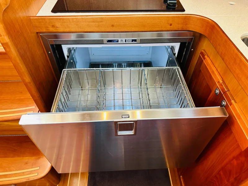 Slide: The Image of Stainless steel drawer dishwasher in 2009 Sabre 42 Hardtop Express yacht kitchen. - 30