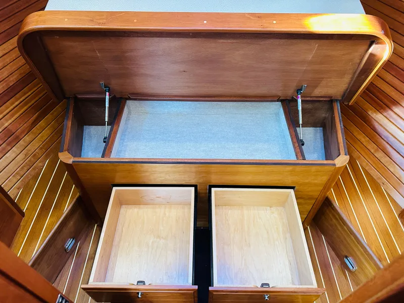 Slide: The Image of Interior storage compartments of 2009 Sabre 42 Hardtop Express yacht, featuring wooden cabinetry. - 37