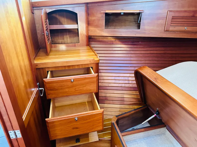 Slide: The Image of Interior of 2009 Sabre 42 Hardtop Express with wooden drawers and storage compartments. - 38