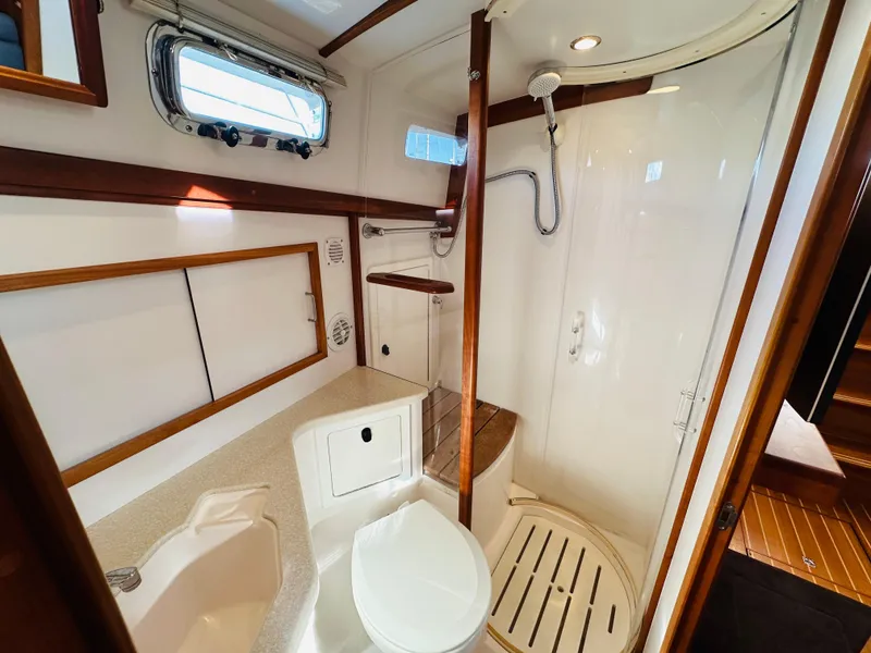 Slide: The Image of Luxurious bathroom in 2009 Sabre 42 Hardtop Express yacht with shower and wooden accents. - 39