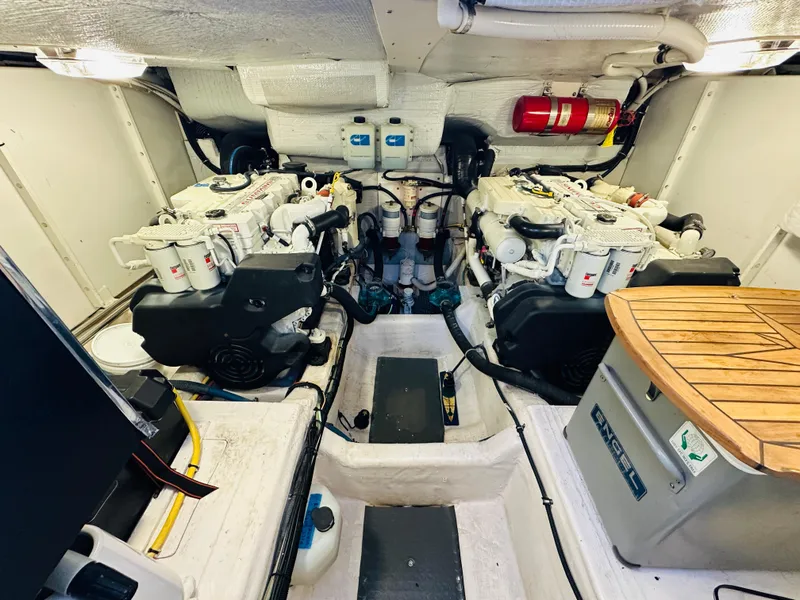 Slide: The Image of Engine room of 2009 Sabre 42 Hardtop Express with dual engines and storage. - 48