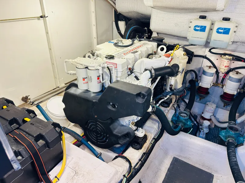 Slide: The Image of Engine room of 2009 Sabre 42 Hardtop Express with visible components and wiring. - 49