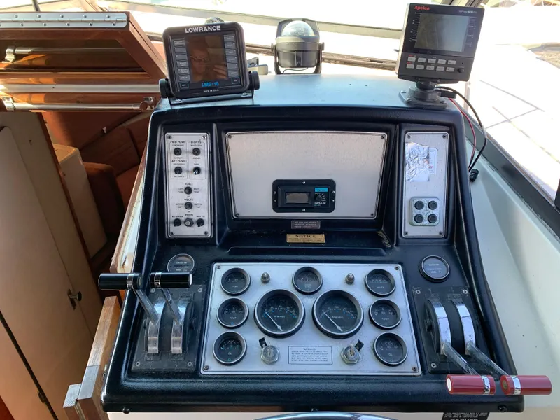 Slide: The Image of Control panel of a 1986 Carver 28 Riviera boat with navigation instruments. - 4
