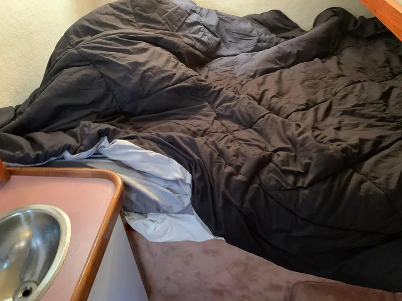 Slide: The Image of Interior of 1986 Carver 28 Riviera with bed and sink. - 7