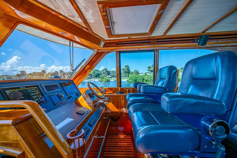 Slide: The Image of 2005 Hinckley Talaria 55 MY helm with blue leather seats and panoramic windows. - 11