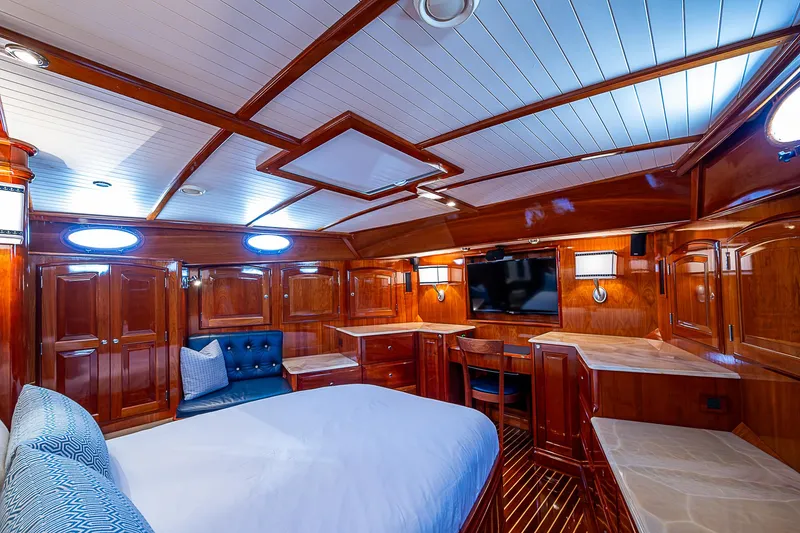Slide: The Image of Luxurious 2005 Hinckley Talaria 55 MY yacht cabin with elegant wood finish and modern amenities. - 19