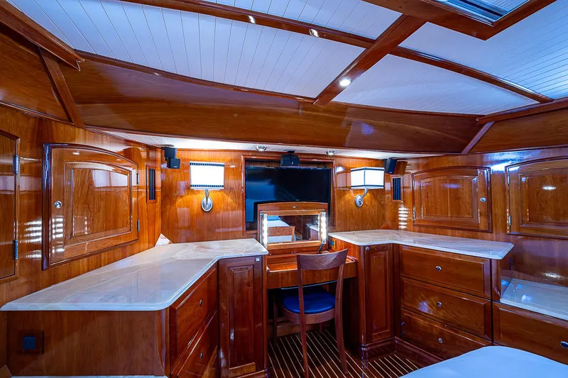 Slide: The Image of Luxurious wooden interior of 2005 Hinckley Talaria 55 MY yacht cabin with desk and lighting. - 20