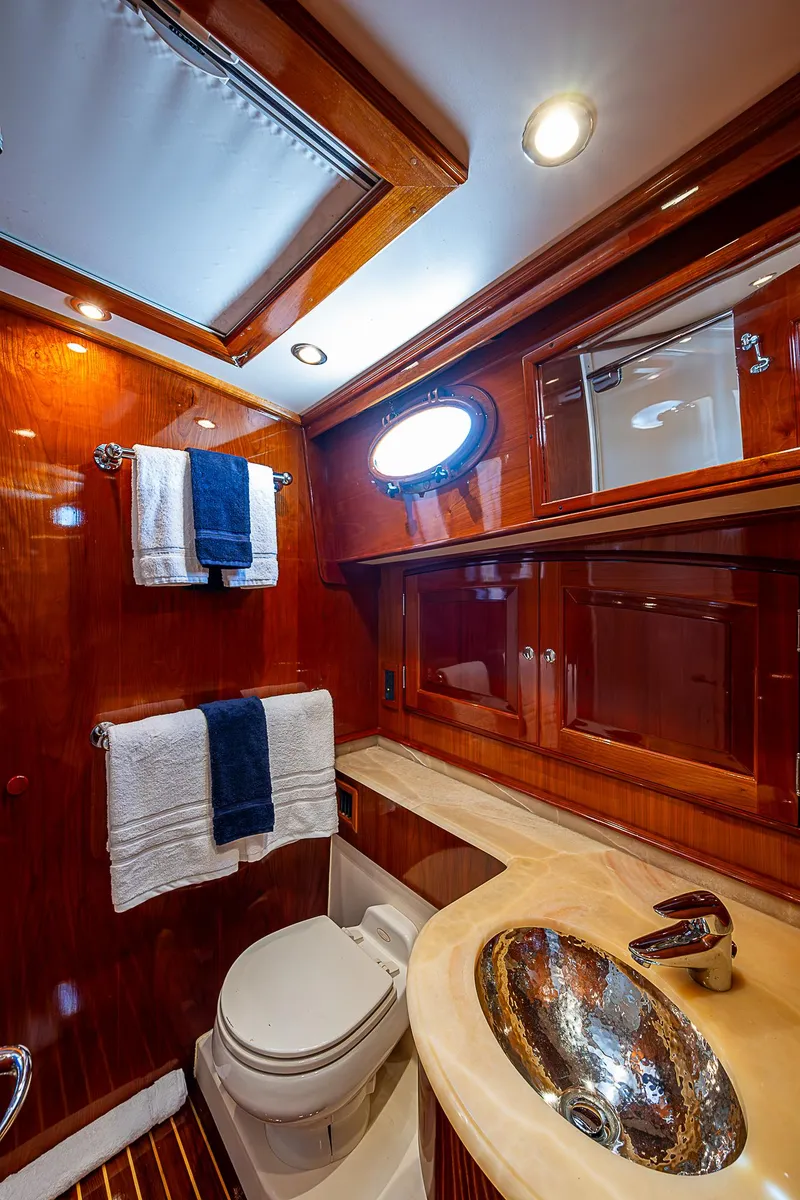 Slide: The Image of Luxurious 2005 Hinckley Talaria 55 MY yacht bathroom with wood accents and modern fixtures. - 24