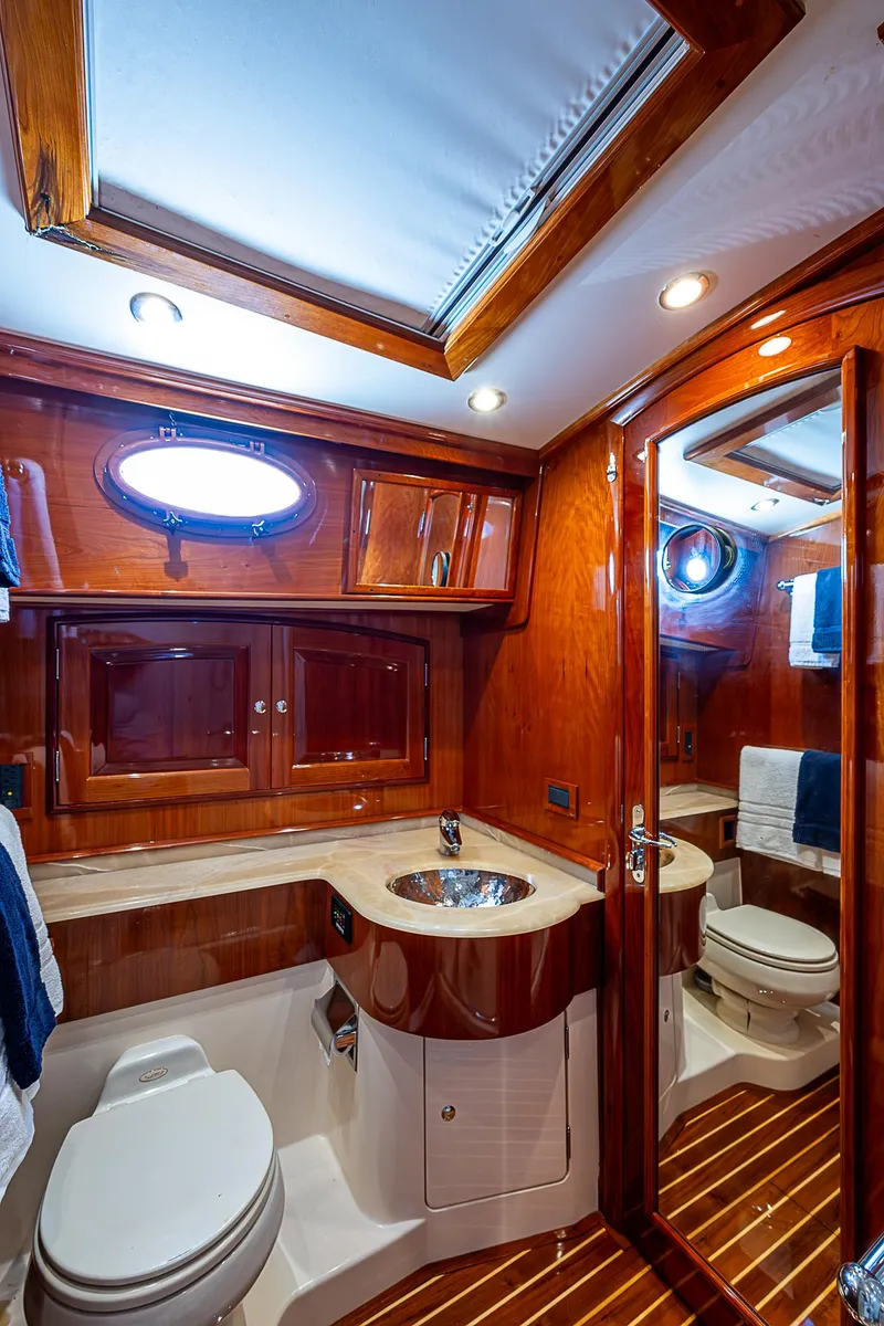Slide: The Image of Luxurious 2005 Hinckley Talaria 55 MY yacht bathroom with wood accents and modern fixtures. - 26