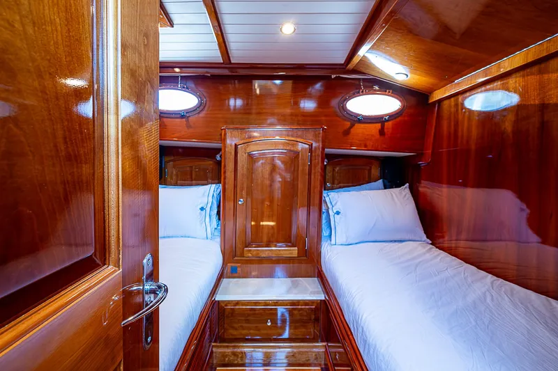 Slide: The Image of Luxurious wooden cabin interior of 2005 Hinckley Talaria 55 MY yacht with twin beds. - 28