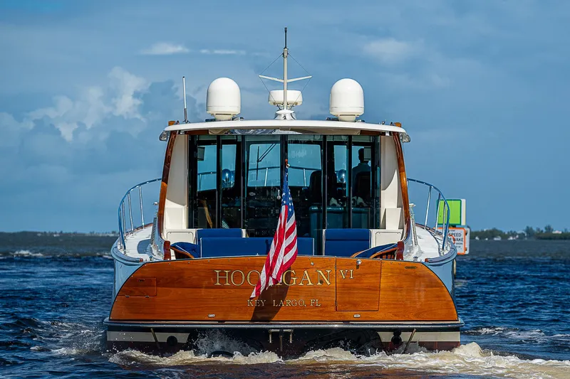 Slide: The Image of Hinckley Talaria 55 MY 2005 yacht on water, rear view with American flag. - 3