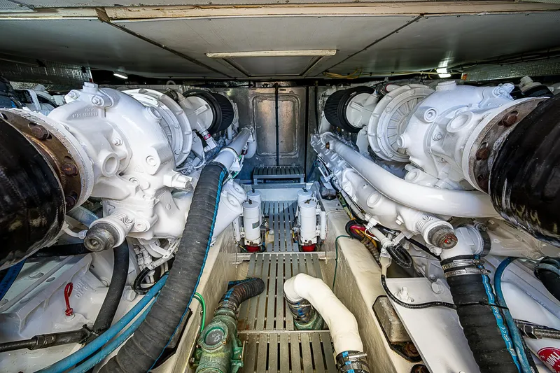 Slide: The Image of Engine room of 2005 Hinckley Talaria 55 MY yacht, showcasing dual engines and mechanical components. - 44