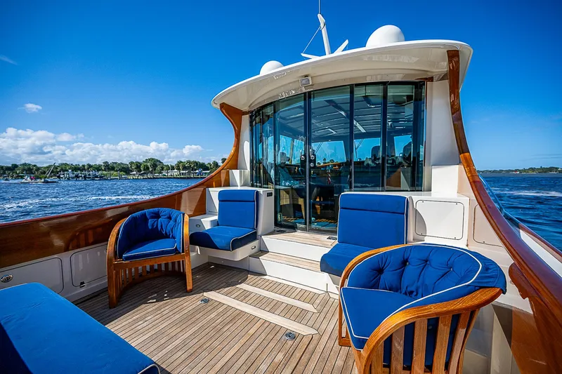 Slide: The Image of Luxurious 2005 Hinckley Talaria 55 MY yacht with elegant seating and scenic ocean view. - 5