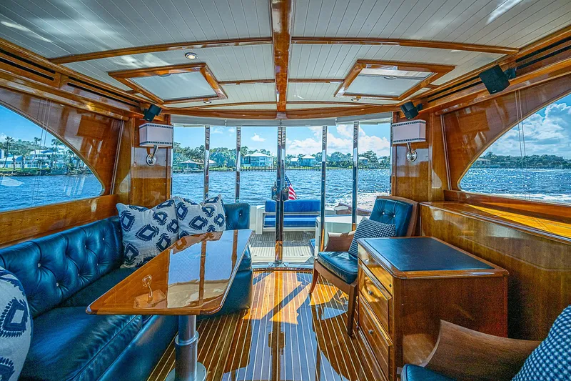 Slide: The Image of Luxurious interior of 2005 Hinckley Talaria 55 MY yacht with elegant wood finish and plush seating. - 7