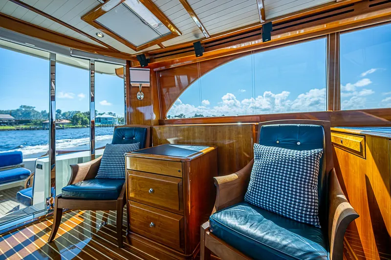 Slide: The Image of Luxurious 2005 Hinckley Talaria 55 MY yacht interior with elegant seating and wood finish. - 9