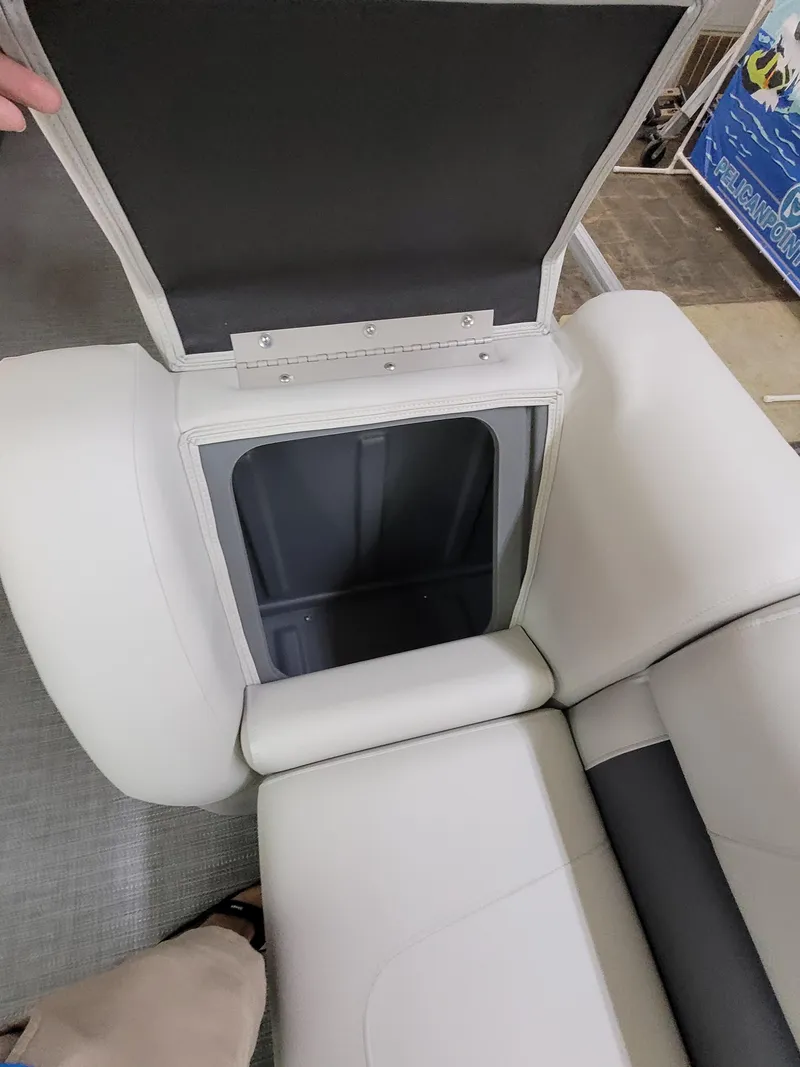 Slide: The Image of Open storage compartment in 2025 SunChaser Vista 22 Fish boat seat. - 10