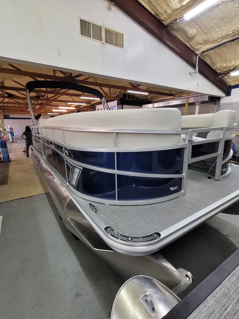Slide: The Image of 2025 SunChaser Vista 22 Fish pontoon boat in showroom, side view. - 3