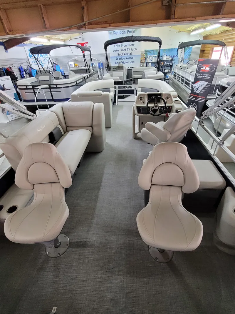 Slide: The Image of 2025 SunChaser Vista 22 Fish pontoon boat interior with plush seating and modern helm. - 4