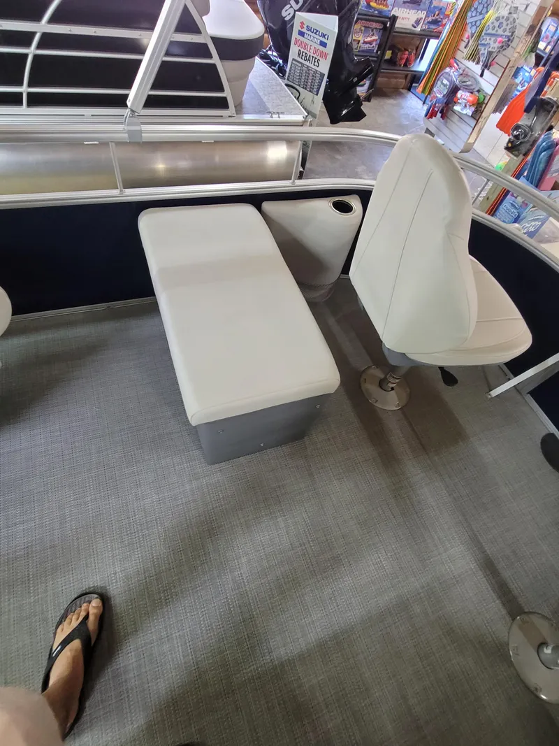 Slide: The Image of 2025 SunChaser Vista 22 Fish boat interior with seating and flooring. - 6