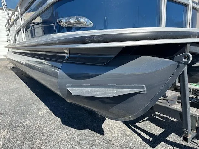Slide: The Image of 2021 Ranger RP243C pontoon boat on trailer, close-up of hull and railing. - 4
