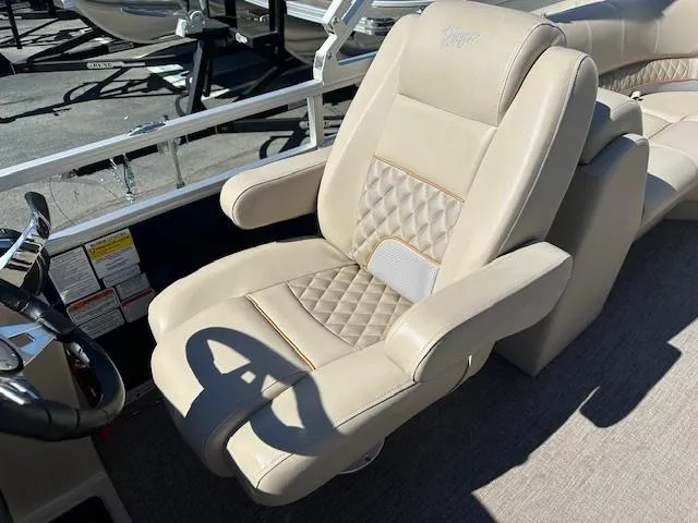 Slide: The Image of 2021 Ranger RP243C boat seat with beige upholstery and quilted design. - 6