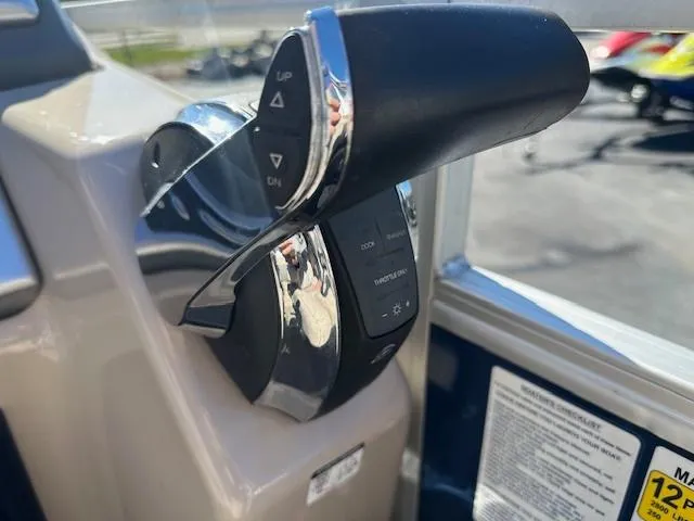 Slide: The Image of Close-up of 2021 Ranger RP243C boat throttle control lever. - 9