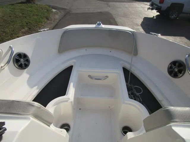 Slide: The Image of 2021 Sea Ray 210 SPX boat interior with seating and storage compartments. - 6