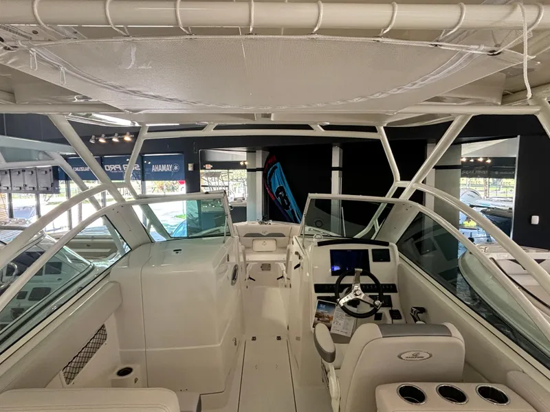 Slide: The Image of 2025 Sailfish 245 DC boat interior with modern helm and seating. - 6