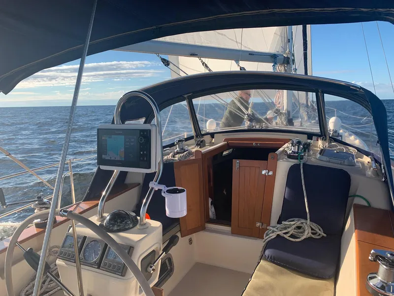 Slide: The Image of Cockpit view of 1997 Island Packet 350 sailboat on open sea. - 12