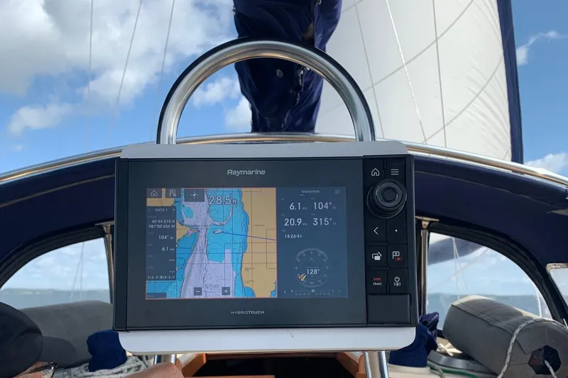 Slide: The Image of Raymarine navigation system on 1997 Island Packet 350 sailboat, under clear skies. - 13