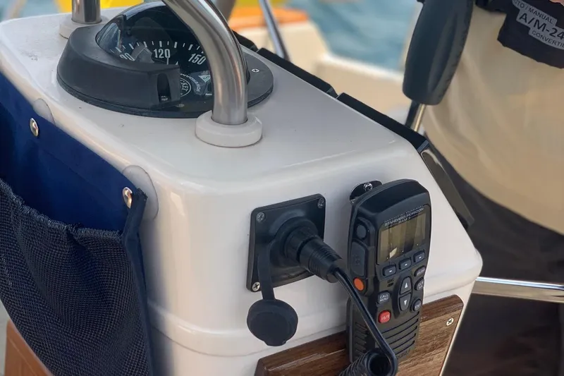 Slide: The Image of Close-up of 1997 Island Packet 350 sailboat helm with compass and radio equipment. - 14