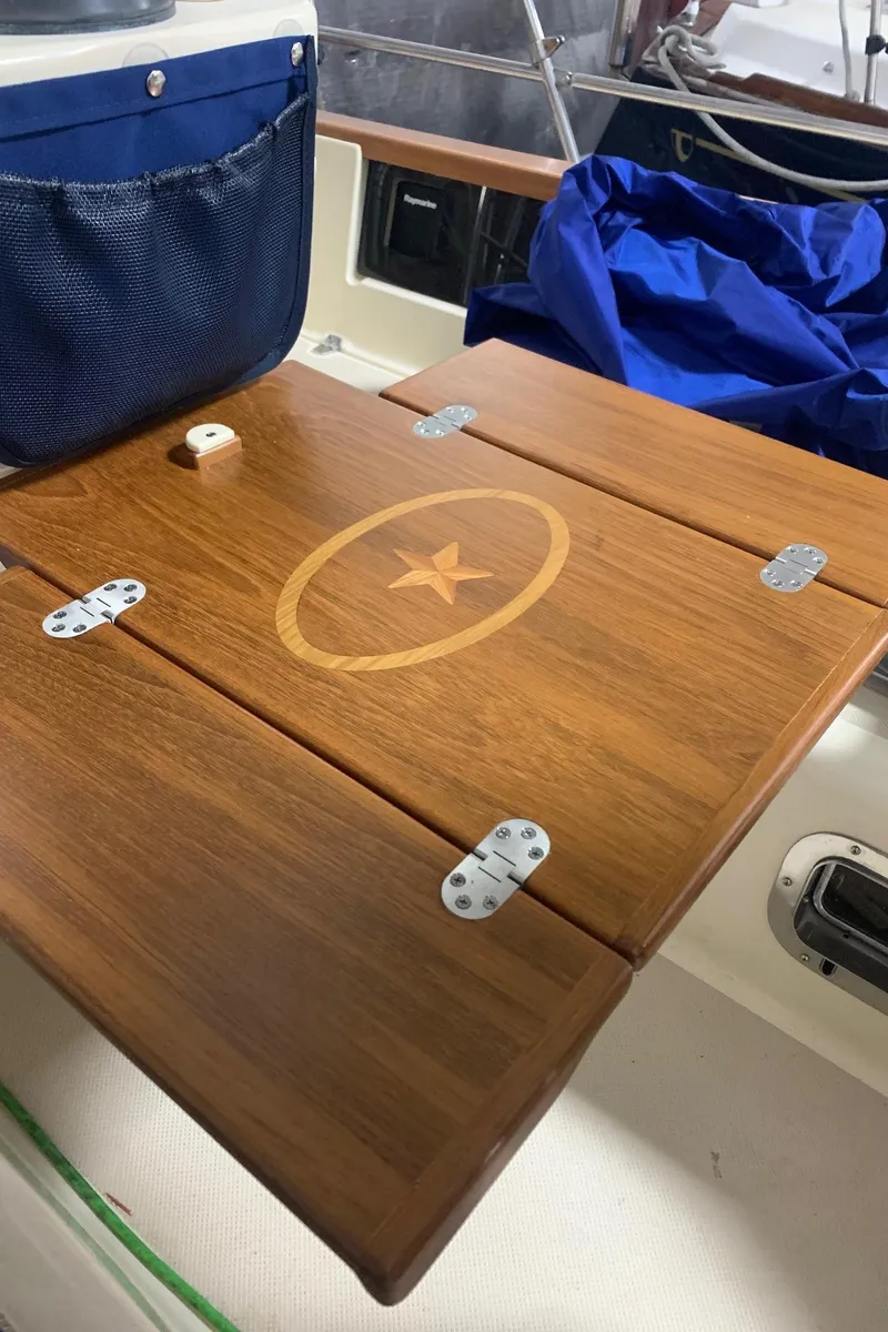 Slide: The Image of Wooden table with star inlay on 1997 Island Packet 350 sailboat. - 15