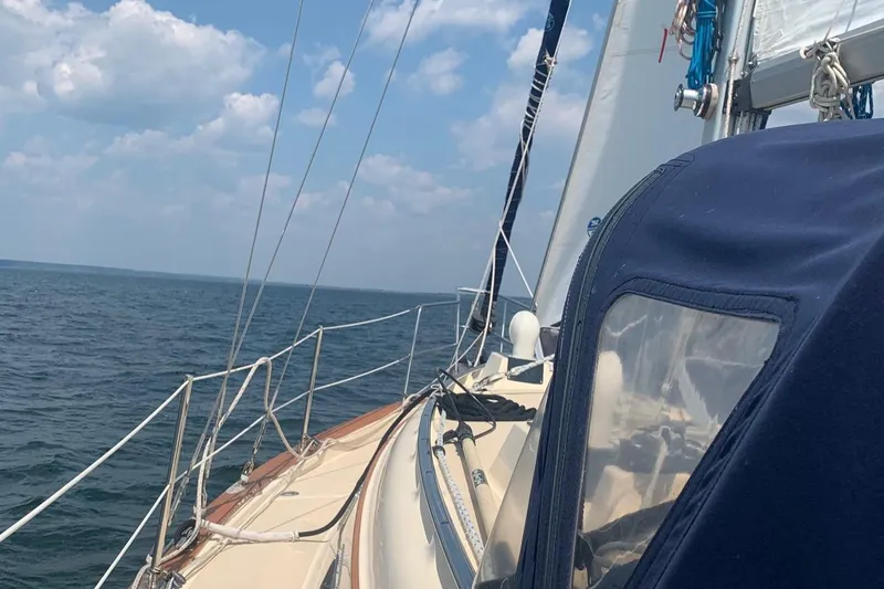 Slide: The Image of Sailing on a 1997 Island Packet 350 yacht under a clear blue sky. - 6