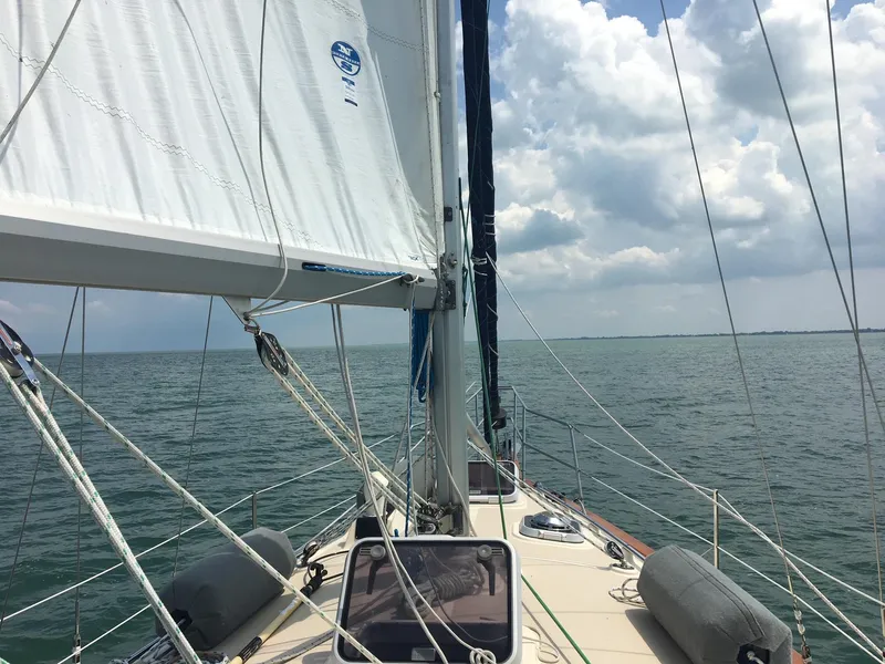 Slide: The Image of Sailing on a 1997 Island Packet 350 yacht under cloudy skies. - 7