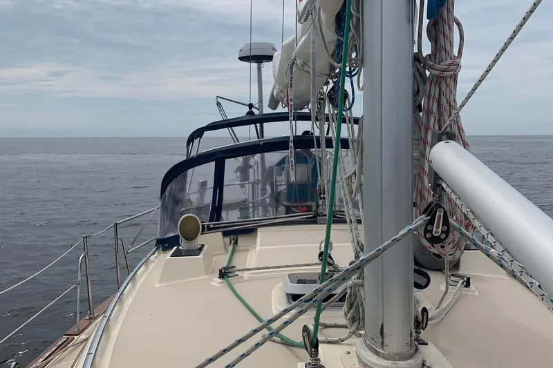 Slide: The Image of 1997 Island Packet 350 sailboat deck with ocean view and rigging. - 8