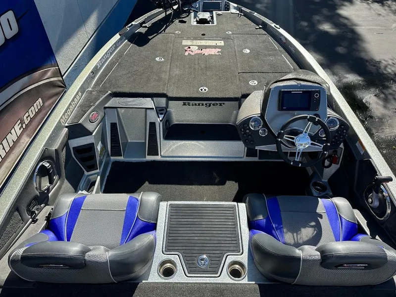 Slide: The Image of 2017 Ranger Z518 boat interior with dual seats and modern dashboard. - 15
